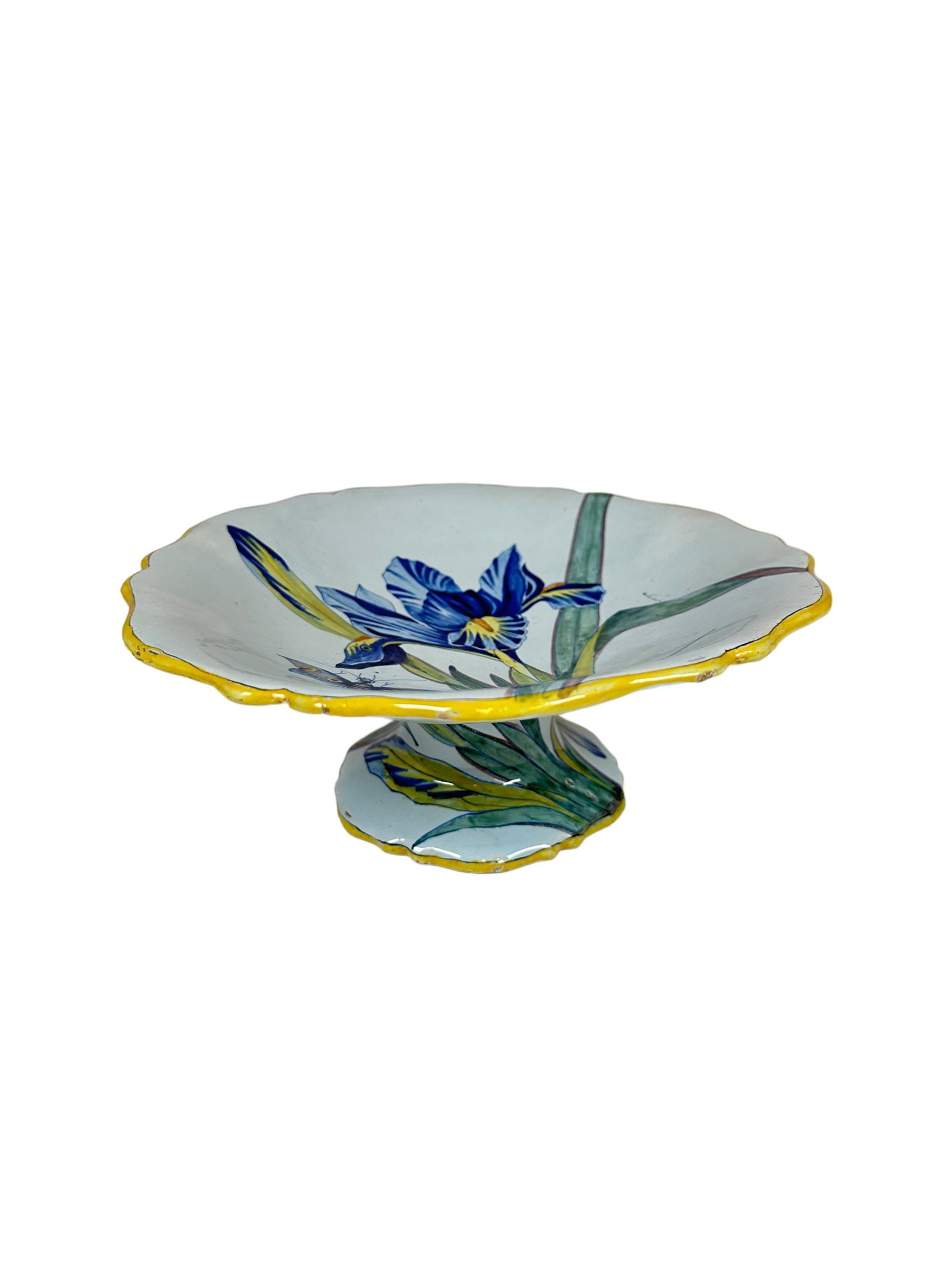 French Faience Quimper Cake Stand From The Serie Botanique by Porquier Beau: French Faience cake stand from the signature Serie Botanique, Botanical Series by Porquier Beau, marked with the intersecting PB on underside. Depicting lilies and butterflies. Measuring H