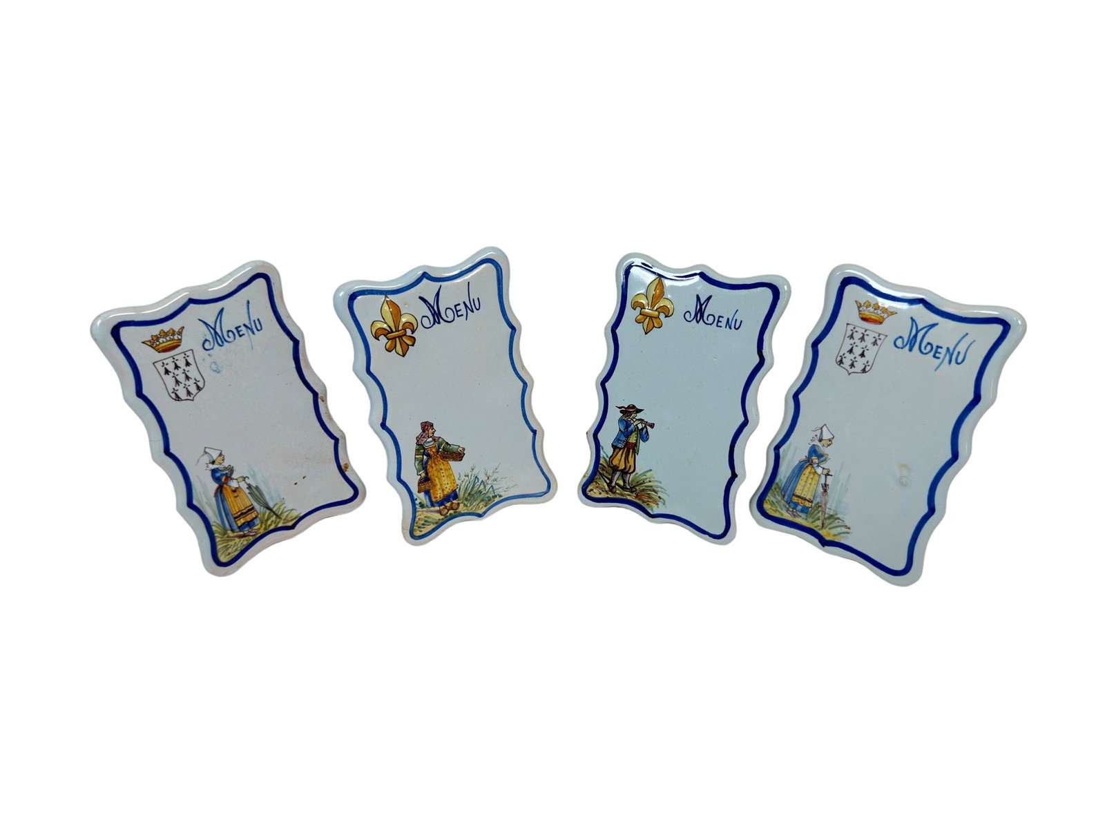 Set of Four Quimper Menu Placements Cards by Porquier Beau: Four French Faience hand painted menu placements cards by Porquier Beau, marked with the intersecting PB on underside. Last quarter of the nineteenth century. Portraying Bretons in traditional c