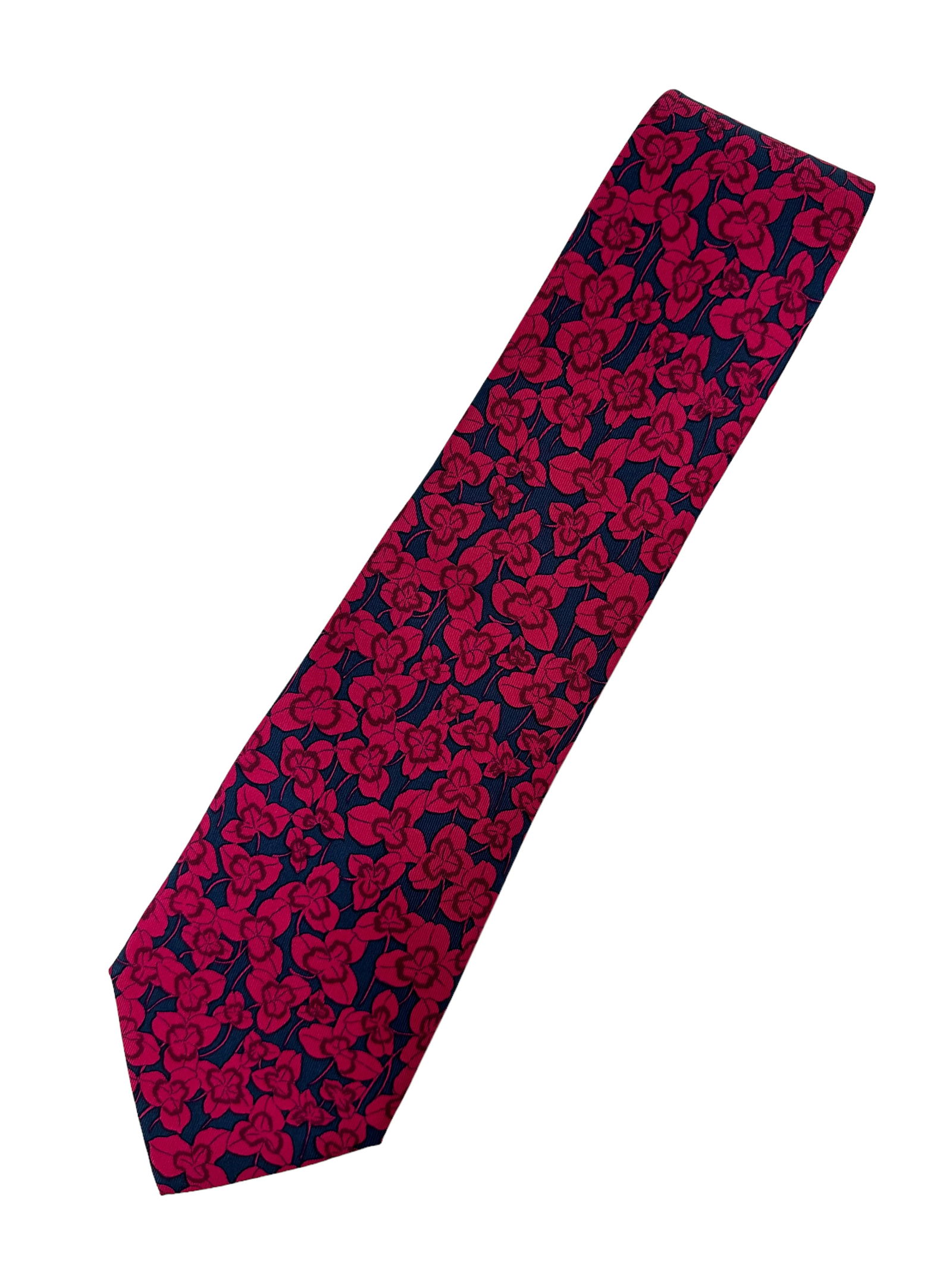 GENTLEMANS HERMES TIE: 100% silk tie in Navy blue with burgundy flowers. In great condition. Provenance: Private Chicago Collector No reserve