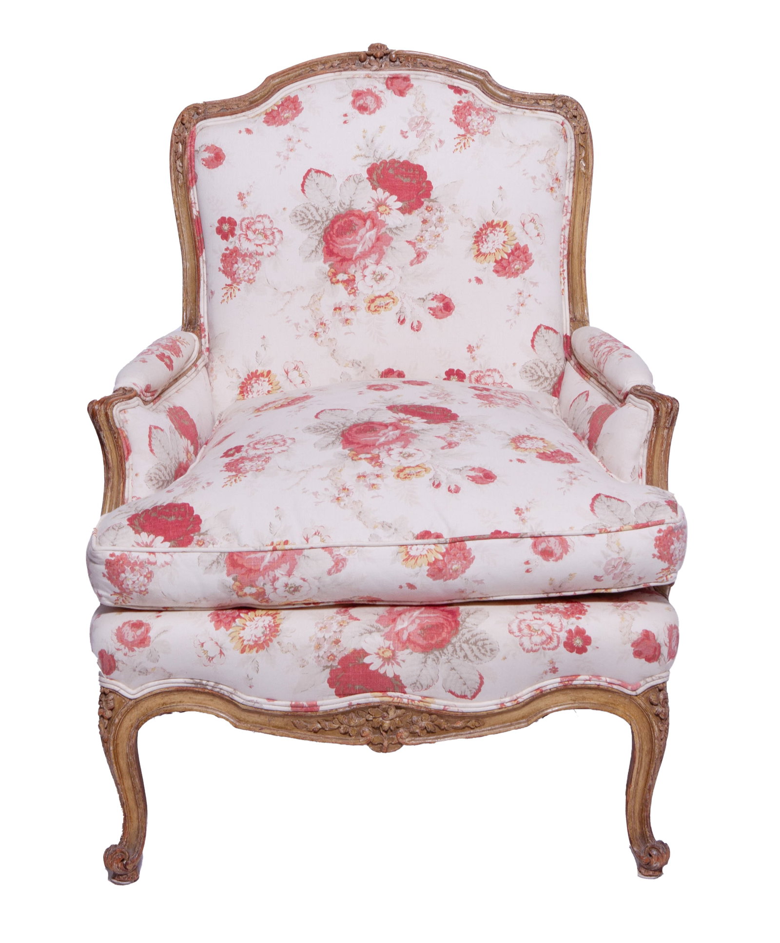 19th Century French Louis XVI Style Upholstered Armchair: Elegant armchair with carved frame, featuring flower buds, leaves and carved legs on a white and red floral upholstery on back, seat and arms, with removable cushion. Measuring H 40 W 30 D 26 in In go