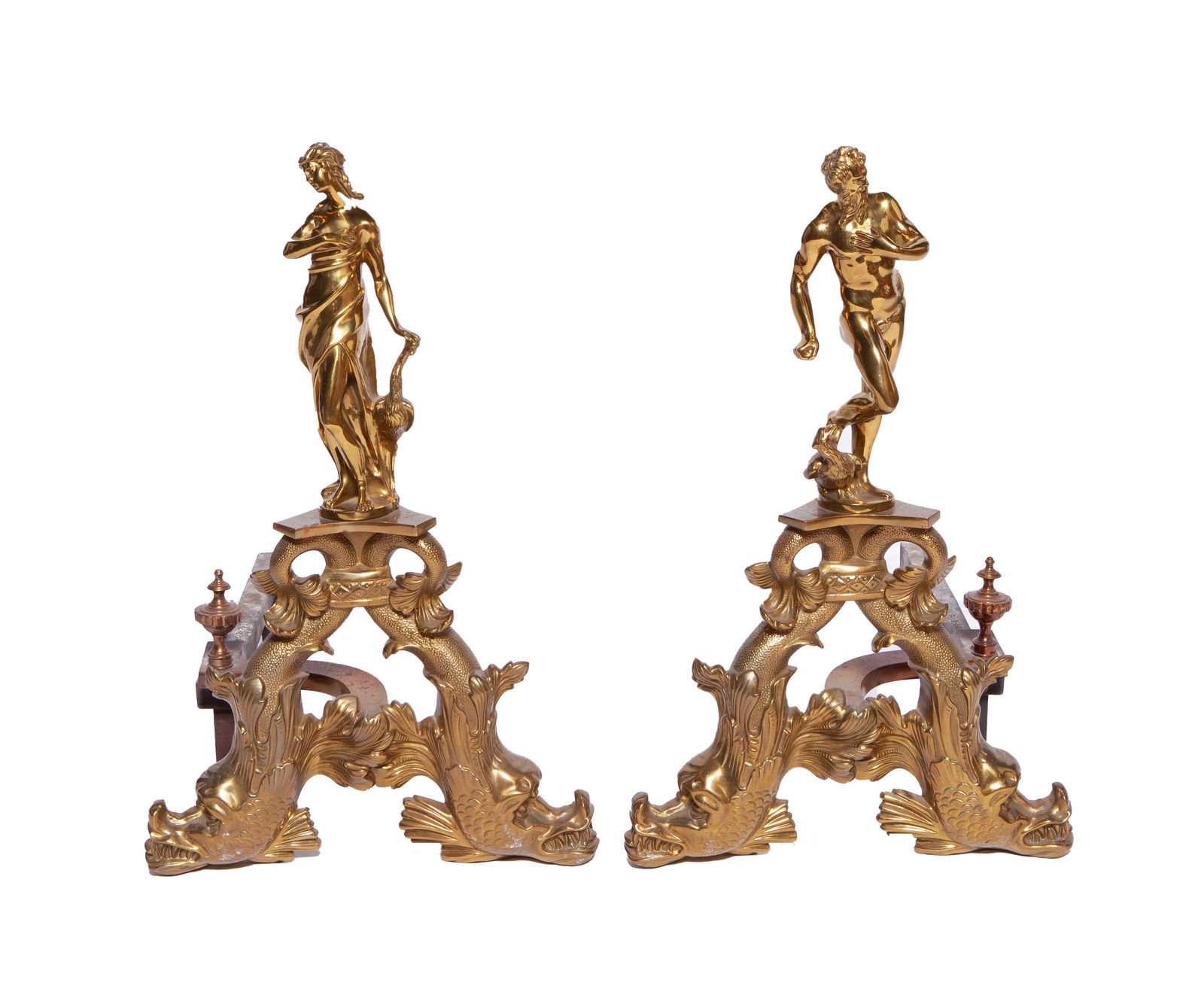 Pair of Decorated Bronze Andirons: Pair of gold tone bronze Andirons decorated with figurines of Venus and Neptune. In good condition. Measuring H 25 D 24.5 in
