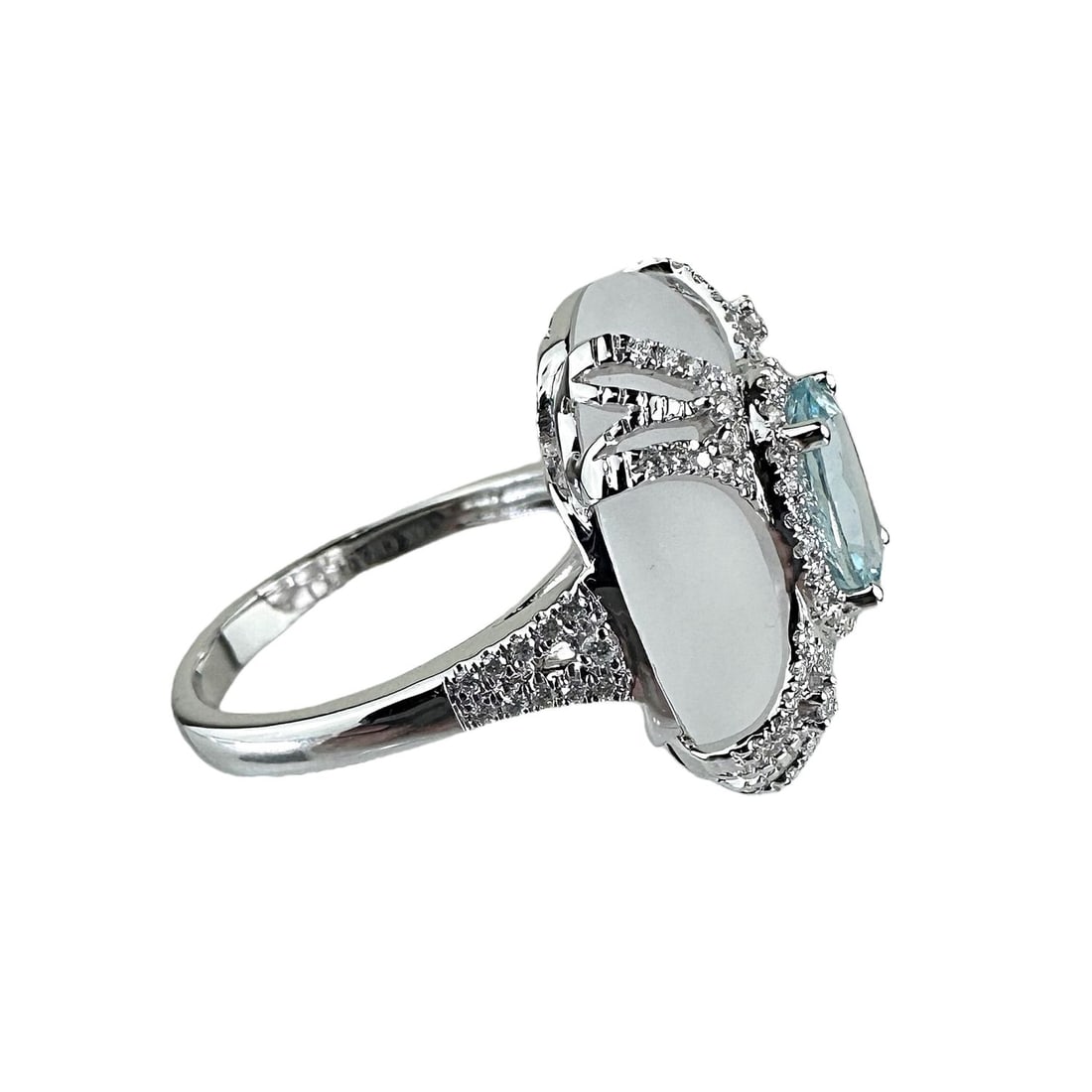 Ladies Aquamarine Ring: Aquamarine and buffed amethyst center stones set in 14k white gold, with 98 round diamonds surrounding the stone and band. 14kt white gold total weight 4g Aquamarine 1.09 Amethyst 7.87 Round Diamonds