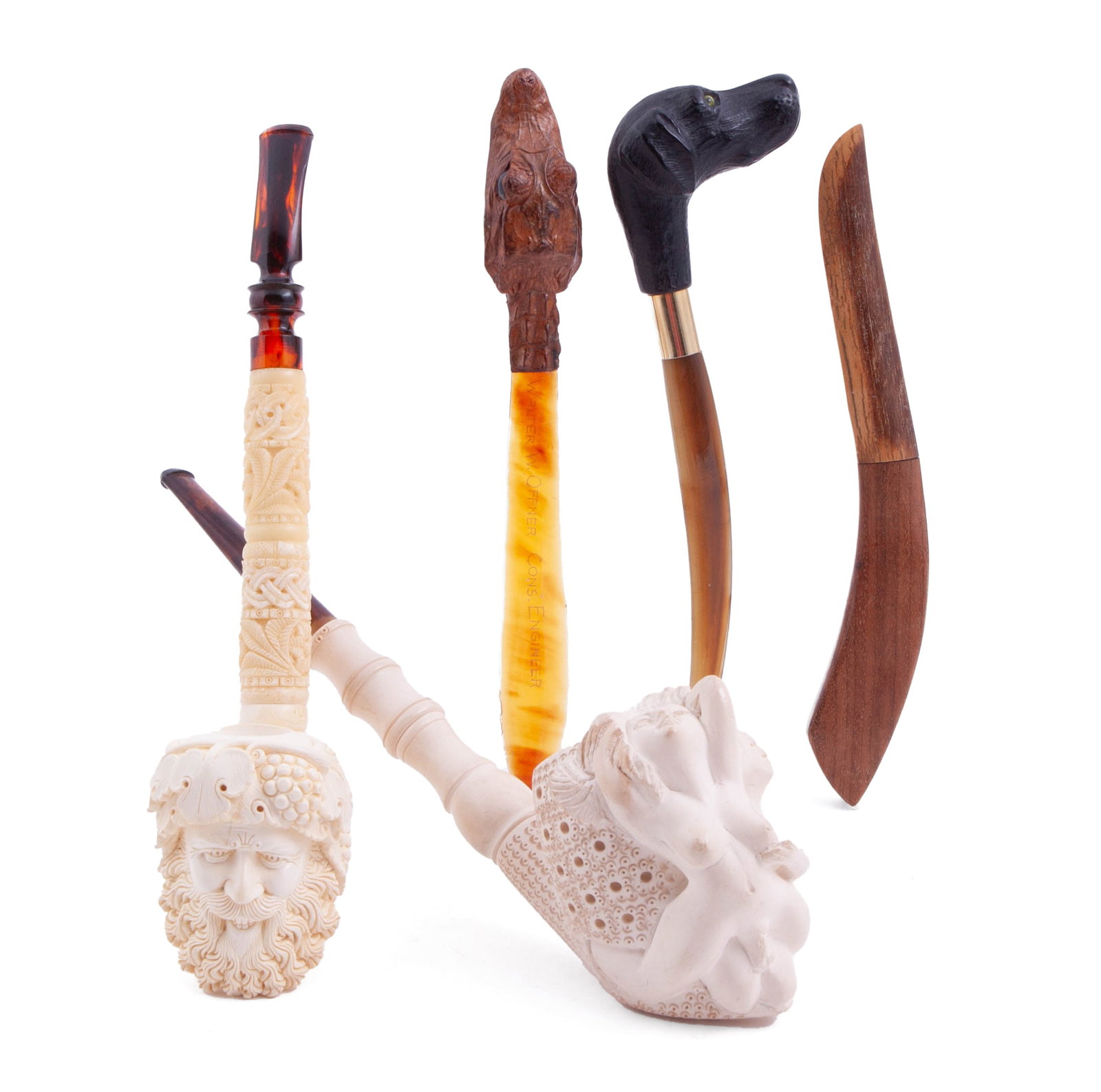 Collection of Two Turkish Bearded Man Meerschaum Pipes and Three Letter Openers: Including: - One smoking pipe carved bone pipe decorated with a bearded man, measuring approx 11 in, - One smoking pipe in celluwood, carved with nude women, measuring approx 11 in - Three carved and 