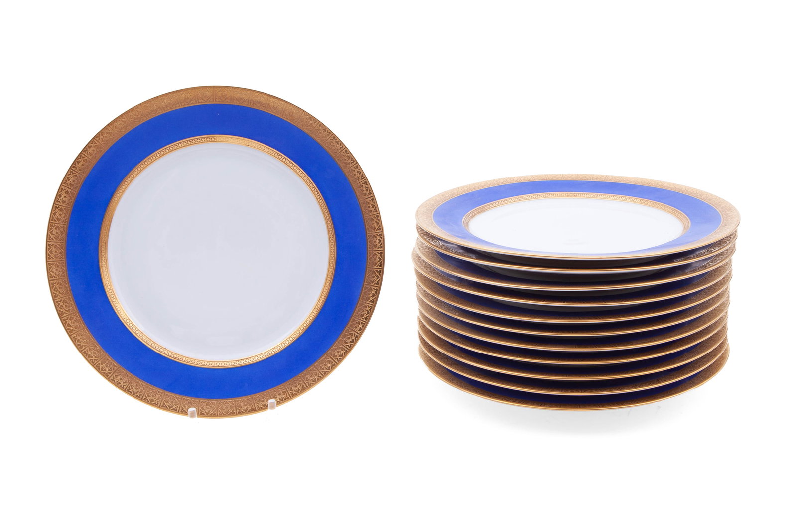 Fraureuth Germany Blue and Gold Dinner Plates: Set of 12 dinner plates measuring 9 3/4 inches wide. In blue and gold, marked on underside. In good condition.
