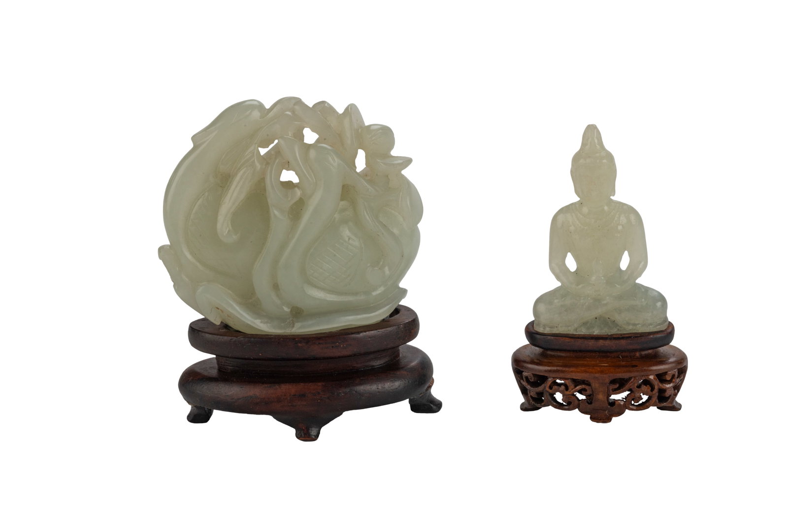 Pair of Chinese Qing Carved Jade Trinkets: One depicts a goose holding a reed in its mouth, measuring D2 in One depicts a sitting Buddha with a carved stand, measuring H 2 W 1.5 in Circa 18-19th century Wear consistent with age.