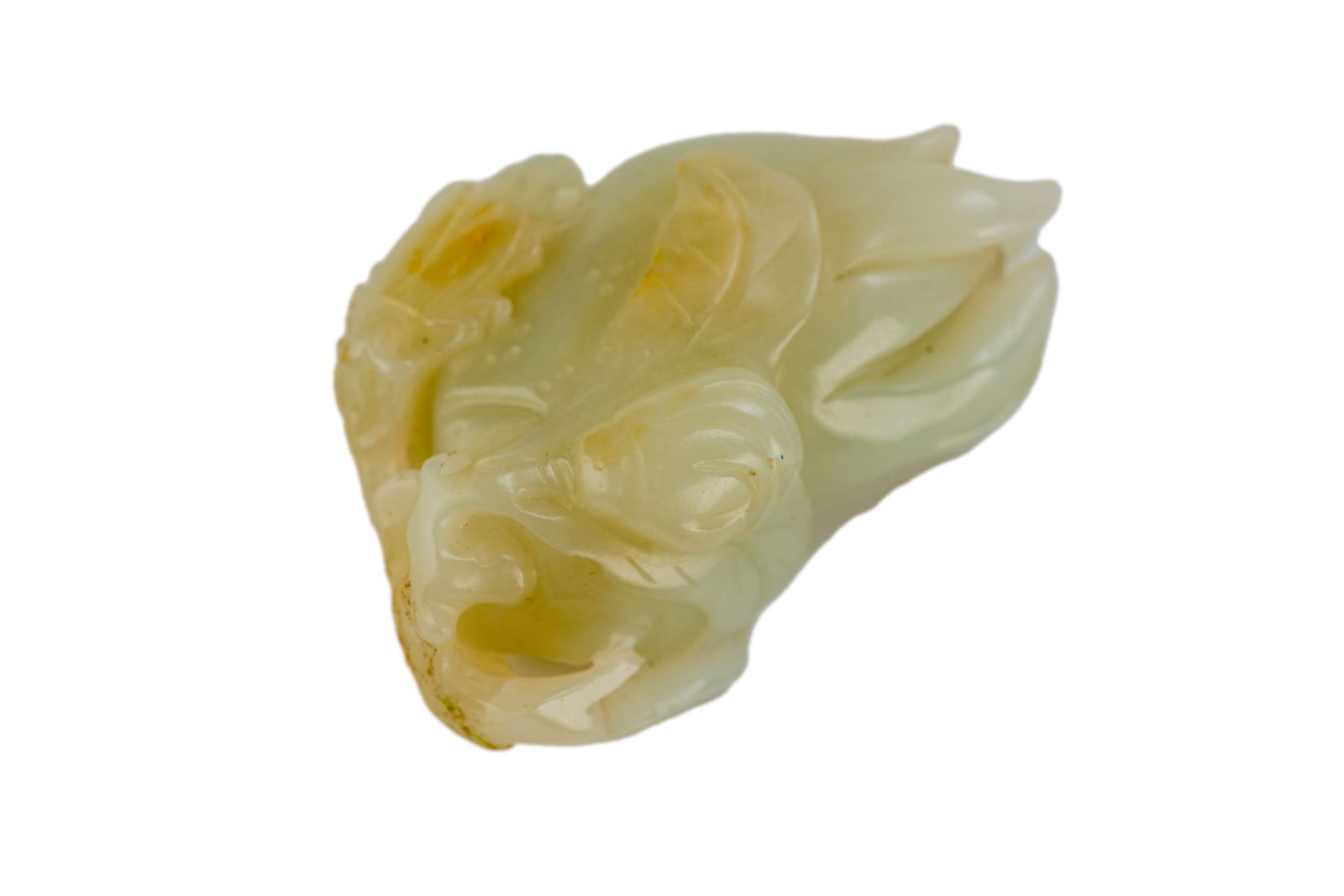 Chinese Qing Carved White Jade: The white piece of jade is carved to reveal a magnolia blossom. 18-19th century 2.5 x 1.75 x 1 in good condition 