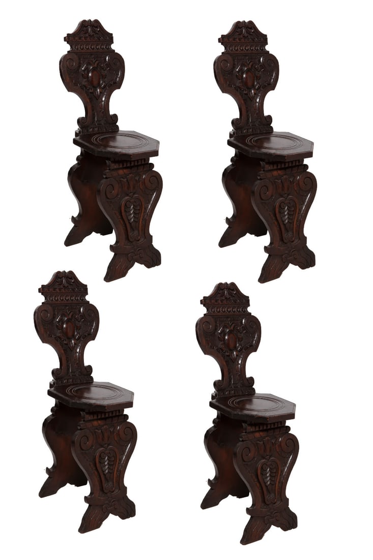 Set of Four Renaissance 19th Century Carved Church Chairs: Beautiful dark wood chairs with fully carved backs and legs and carved details on hexagonal seats. Measuring H 37.5 x W 12 x D 17 inches Some scratches to the surface.