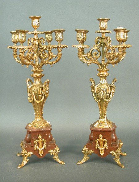 Pair of ormolu and rouge marble Louis X: Pair of ormolu and rouge marble Louis XVI style four branch candelabra with central candleholder. Decorated with swags and masks. Back ormolu foot missing from one, circa 1910 - 21"t x 8"w $400-700
