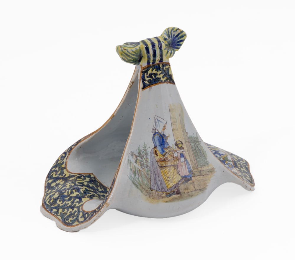 Rare French Faience Papillon Vase by Porquier Beau Quimper: Elegant papillon vase, marked with PB monogram on underside. Portraying Breton villagers in traditional attire, featuring a blue and yellow arabesque and the coat of arms of Brittany. Measuring 