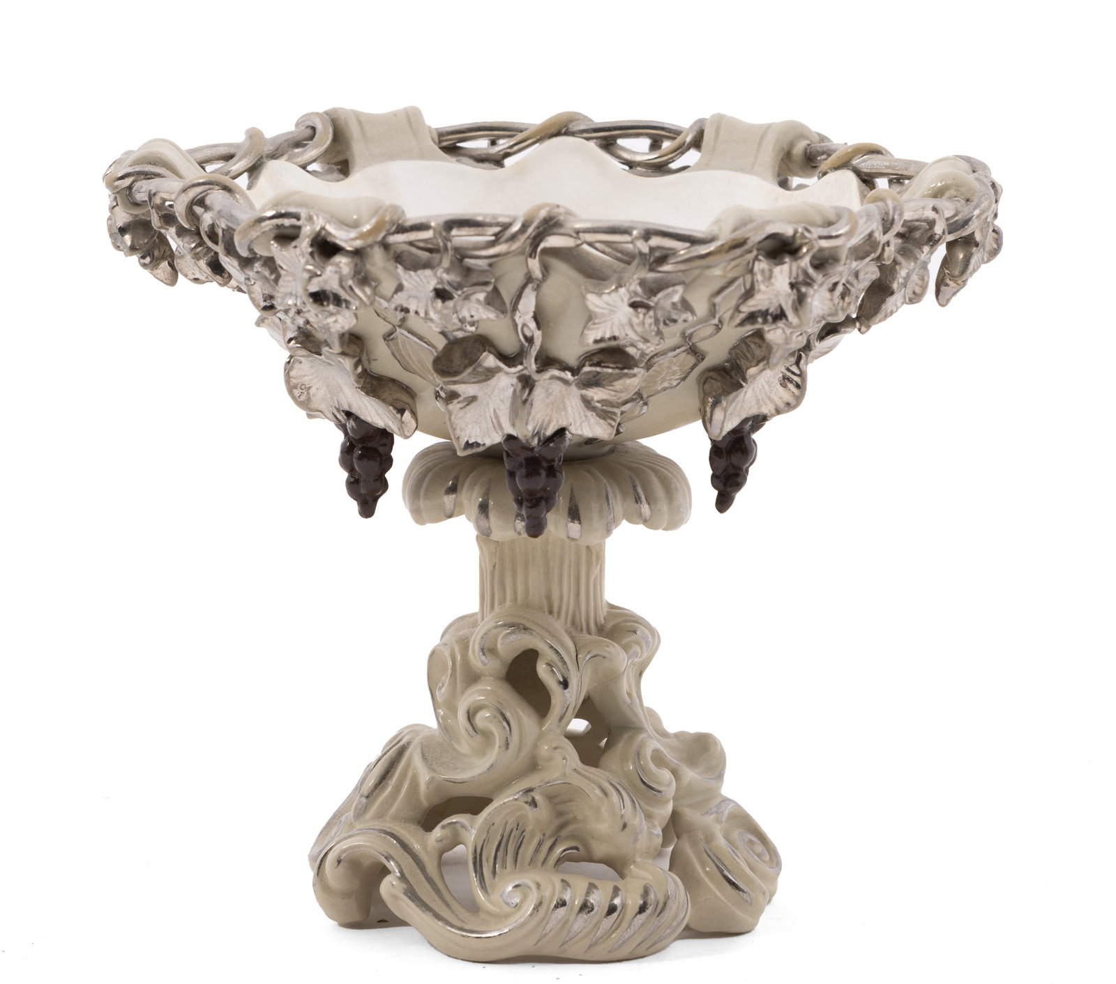 Mettlach German Porcelain Compote with Grapes: Beautiful German compote with silver overlay and dark purple hanging grapes. Measuring H 6 W 7 inches. Marked 346 on the underside. Condition: some dents to the surface.