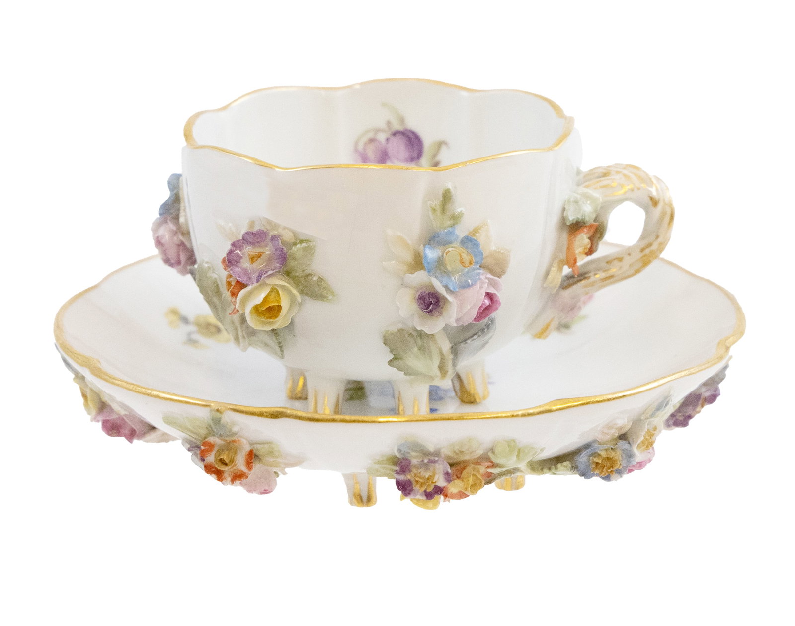 Meissen Demitasse and Saucer with Painted and Applied Porcelain Flowers: Delicate Meissen demitasse and saucer with painted and applied porcelain flowers throughout. Marked with Meissen setter on underside Cup: D 1.5 W 2.5 inches. Saucer H 1 W 4 inches Overall go