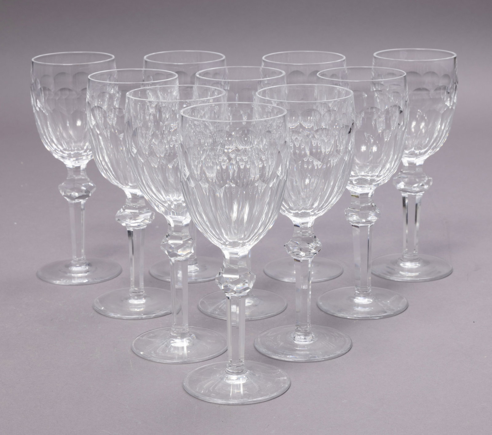 Ten Waterford Crystal Curraghmore Goblets: Ten beautiful Waterford Crystal Curraghmore goblets. These faceted goblets have a faceted know that is expertly shaped to add sparkle to the stem. The plain bottom is marked with the Waterford marking