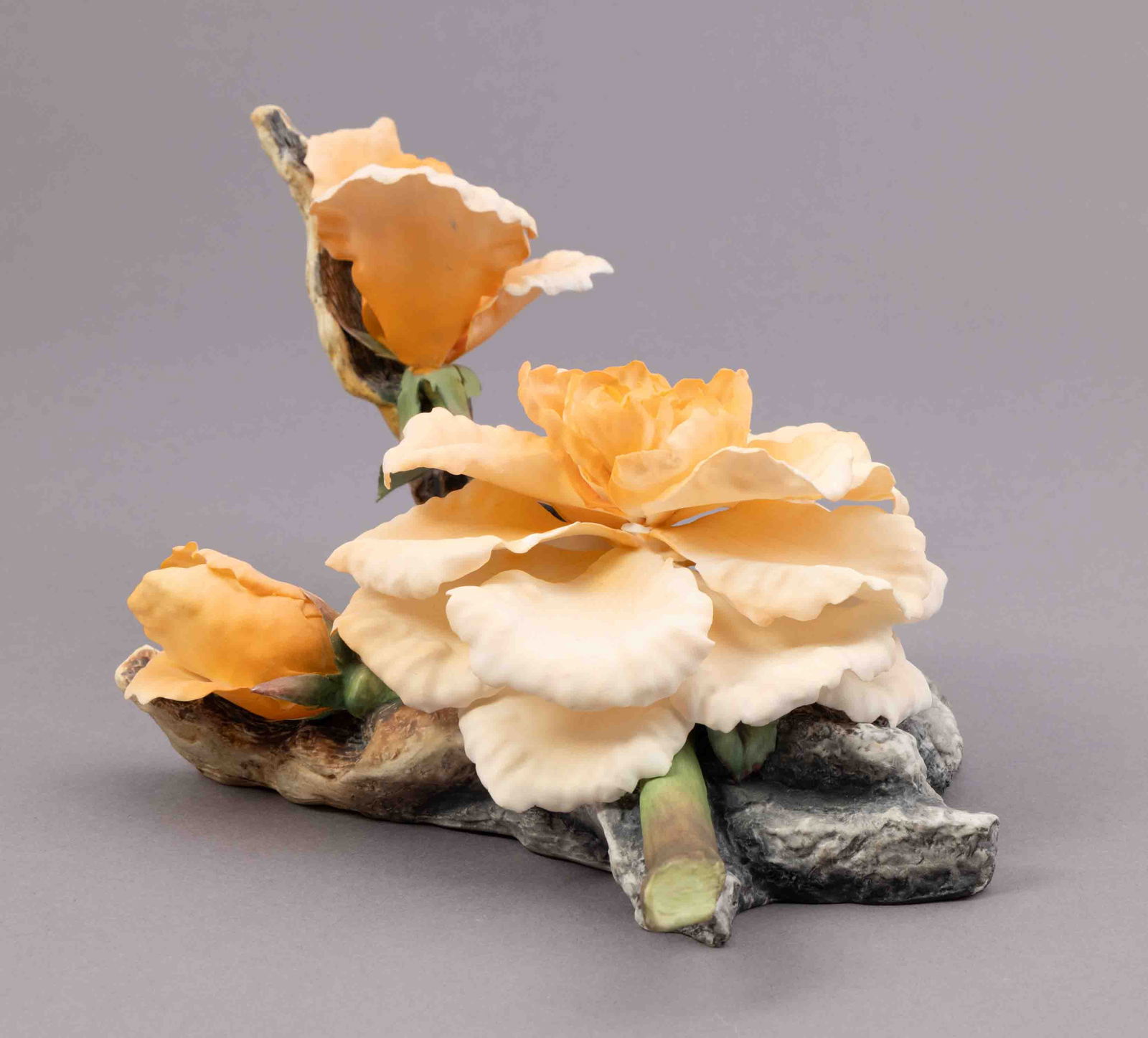 Bohem Bone Porcelain Flower Camellia: Bohem bone porcelain floral figurine of orange camellias. Marked on underside. Measuring H 5 W 11.5 inches Condition: slight damage and missing petal.