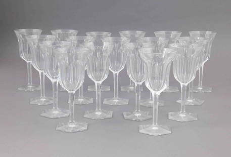 Set of Seventeen Baccarat Crystal Cordial Glasses: Set of seventeen Baccarat crystal cordial glasses with a faceted stem and hexagonal base. They are all marked on the underside with the Baccarat maker's mark. They measure H 7 W 3.25 inches. Con