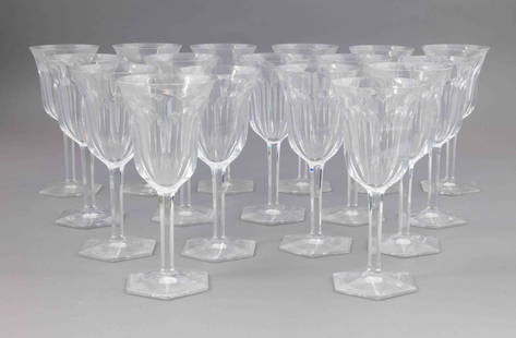 Set of Seventeen Baccarat Crystal Water Goblets: A set of seventeen Baccarat crystal water goblets with a fauceted stem and hexagonal base. They are all marked on the underside with the Baccarat etching. They measure H 8 W 3.75 D 3.75 inches.