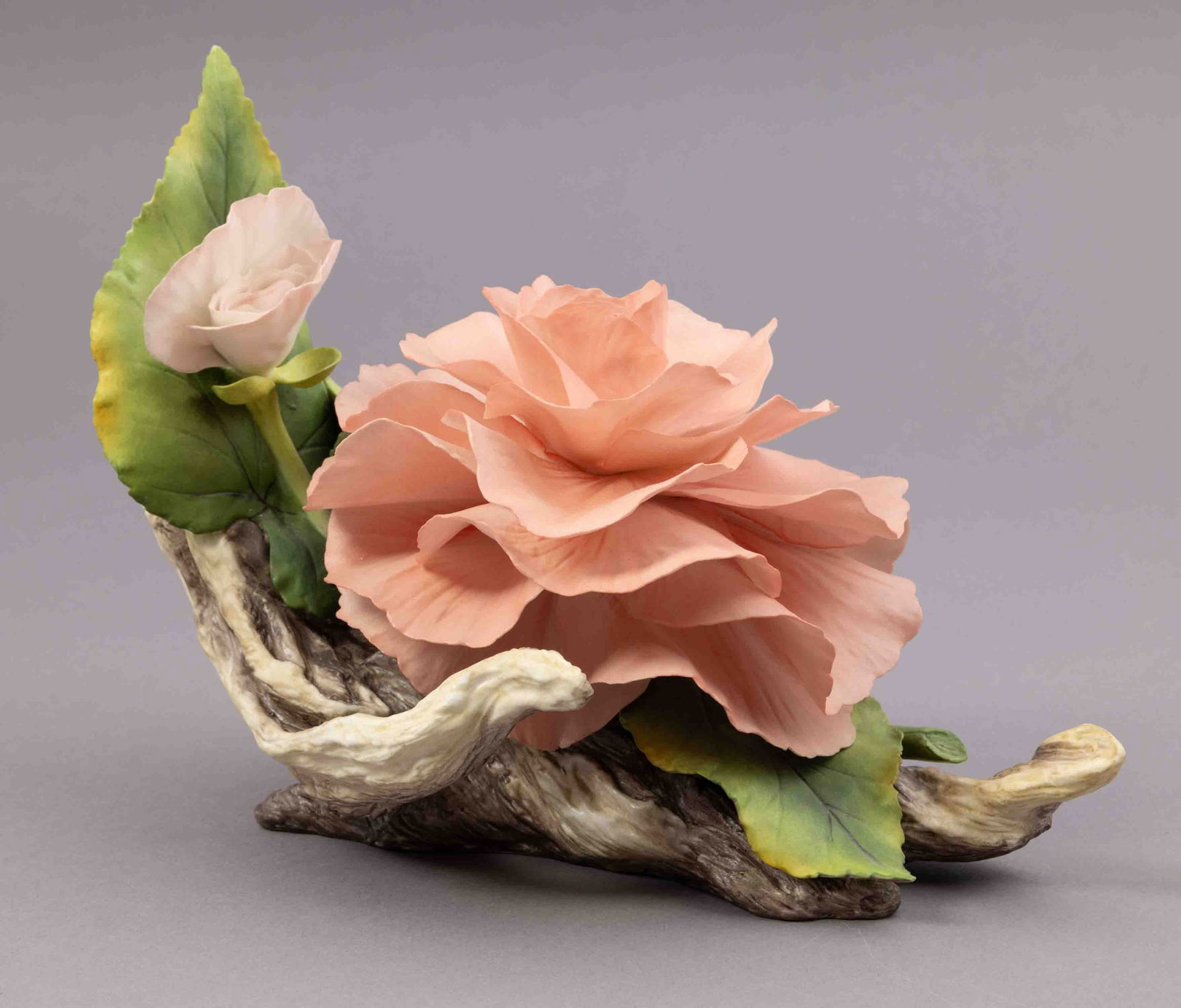 Boehm Bone Porcelain Flower, Roy Hartley Bergonia: Boehm bone porcelain floral figurine of a pink rose. Marked on underside and signed. Measuring H 7 W 10 inches Condition: slight damage and missing petal.