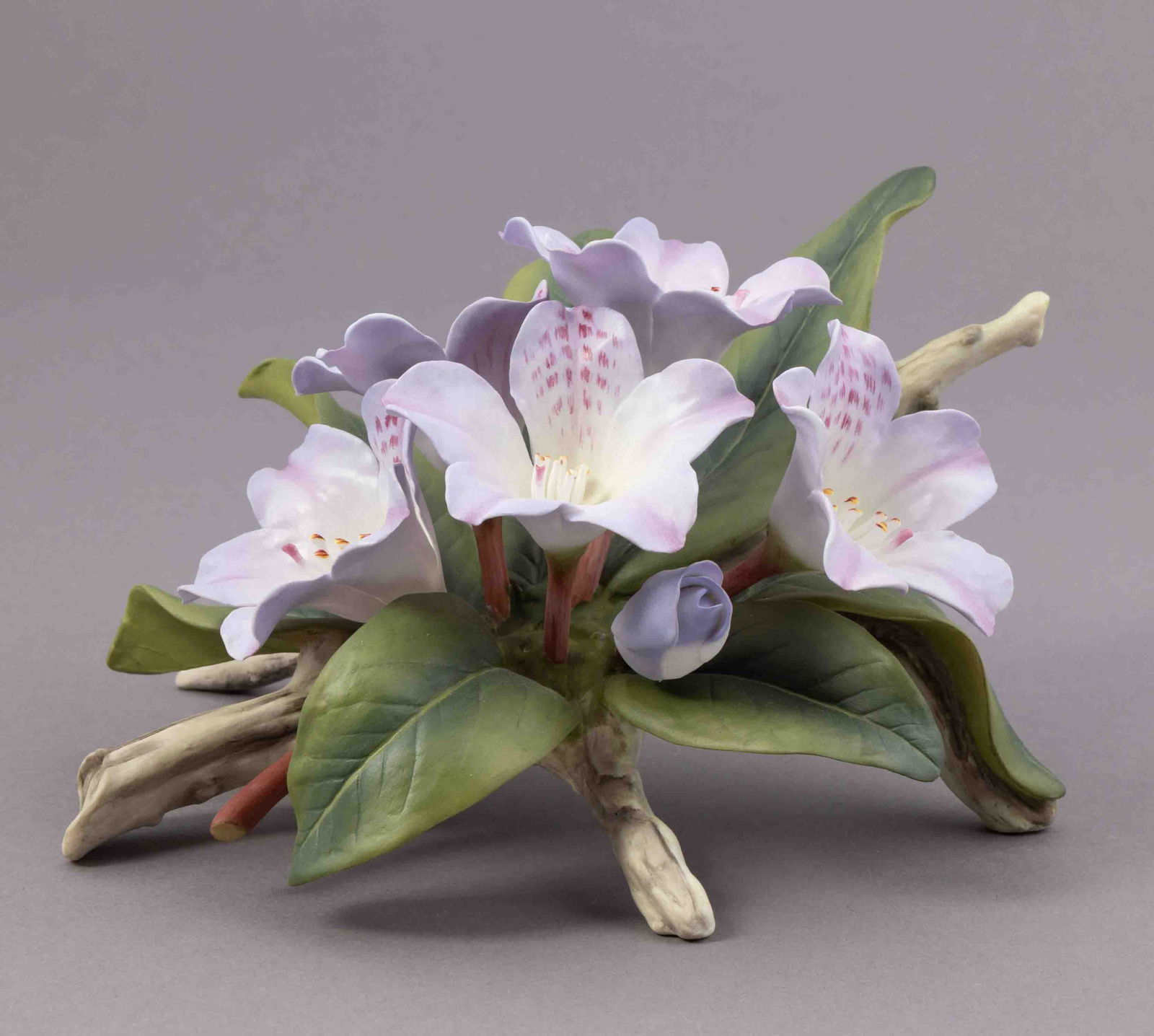 Boehm Bone Porcelain Flower, Rhododendron: Boehm bone porcelain floral figurine of a rhododendron. Marked on underside and signed. Measuring H 4 W 9 inches Condition: good.