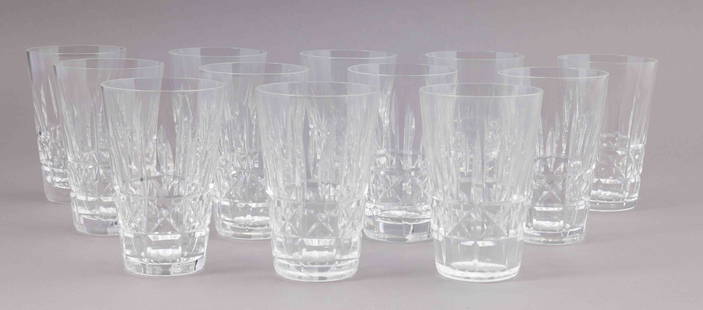 Set of Twelve Waterford Crystal Water Glasses: Set of twelve crystal water glasses. Ten are marked on the underside with the Waterford maker's mark, and two of them have been replaced with non-marked, similar-style glasses. They measure H 5 W 3.25