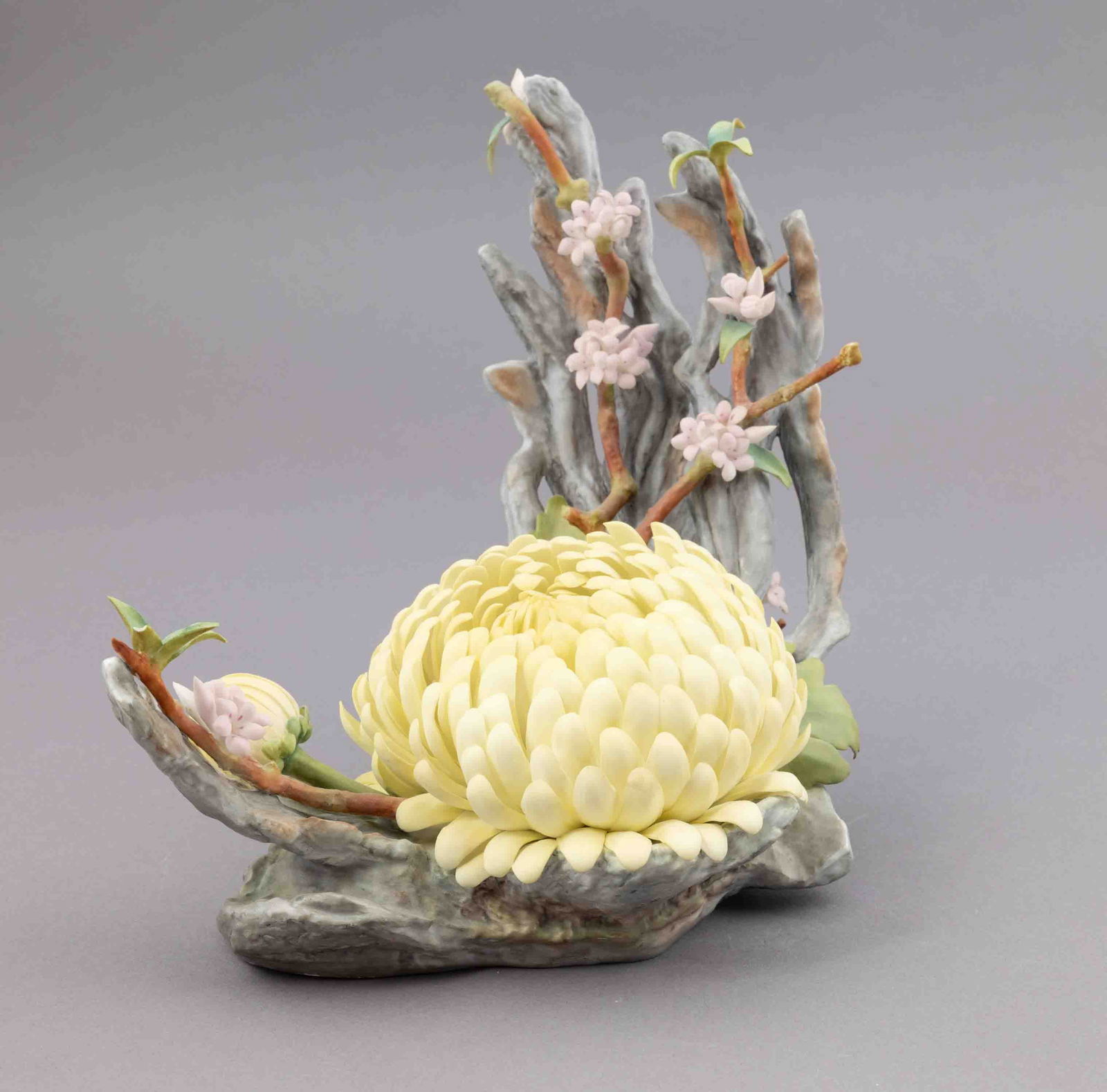 Boehm Bone Porcelain Flower, Yellow Chrysanthemum with Vibernum: Boehm bone porcelain floral figurine, yellow Chrysanthemum. Marked on underside. Measuring H 8.5 W 10 inches Condition: good.