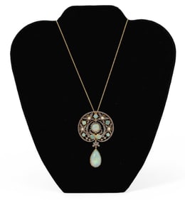 Ladies Elegant Decorated Opal Pendant Strung on a Gold Necklace