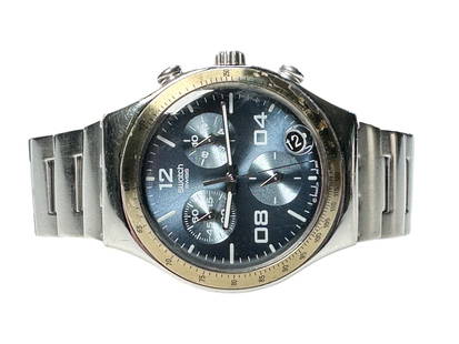 Vintage Stainless Steel Swatch Iriny Quartz Watch: Swatch Iriny Swiss quartz, stainless steel with gold tone bezel and a steel blue chronograph dial with a fresh battery.