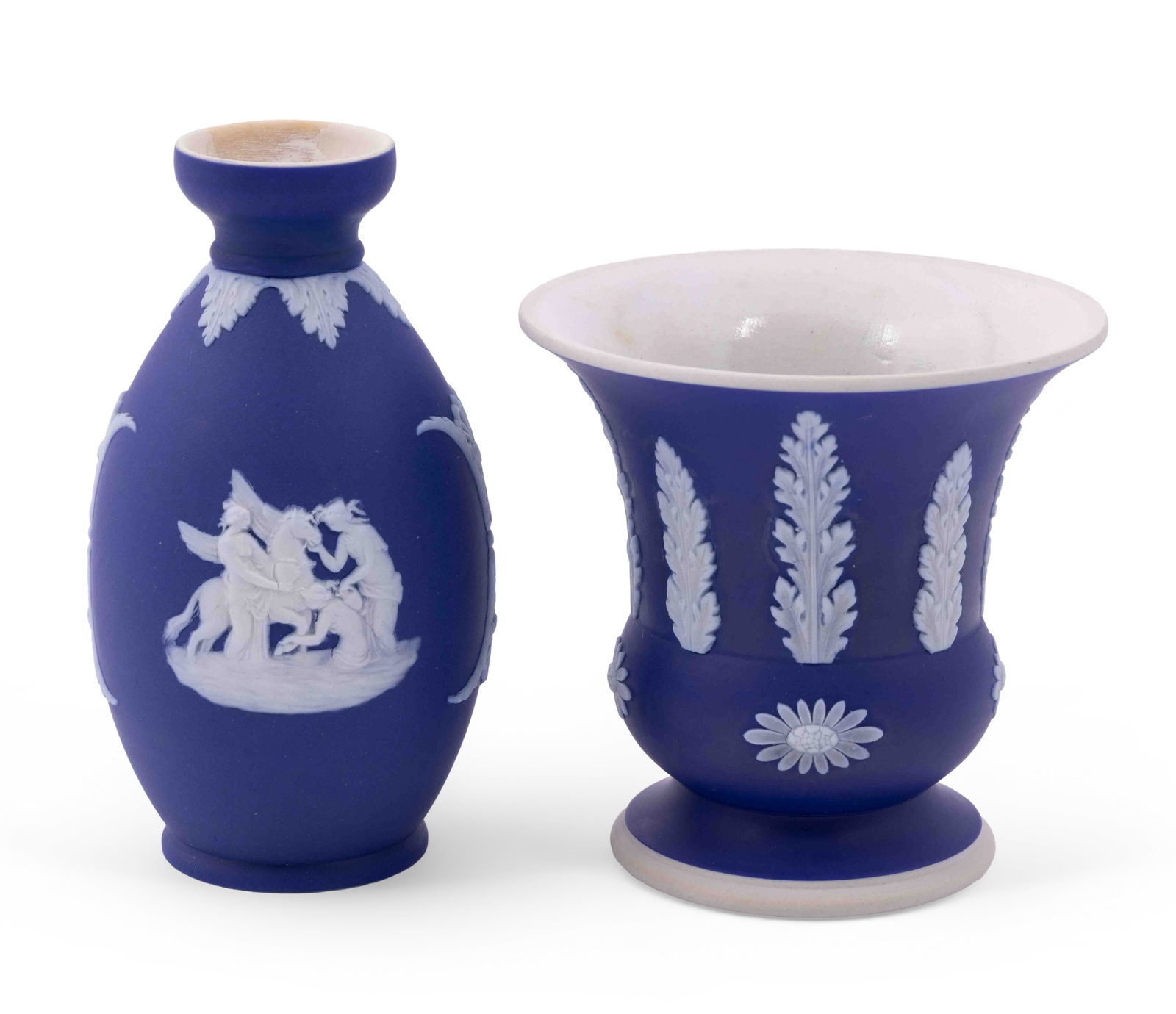 Pair of Wedgwood Jasperware Cobalt Blue Vases: A Wedgwood Jasperware small vase, measuring H 4 D 4 inches and a bud vase measuring H 5.5 W 2.5 inches, both in blue cobalt, marked Wedgwood Made in England on underside. Condition: signs of rep