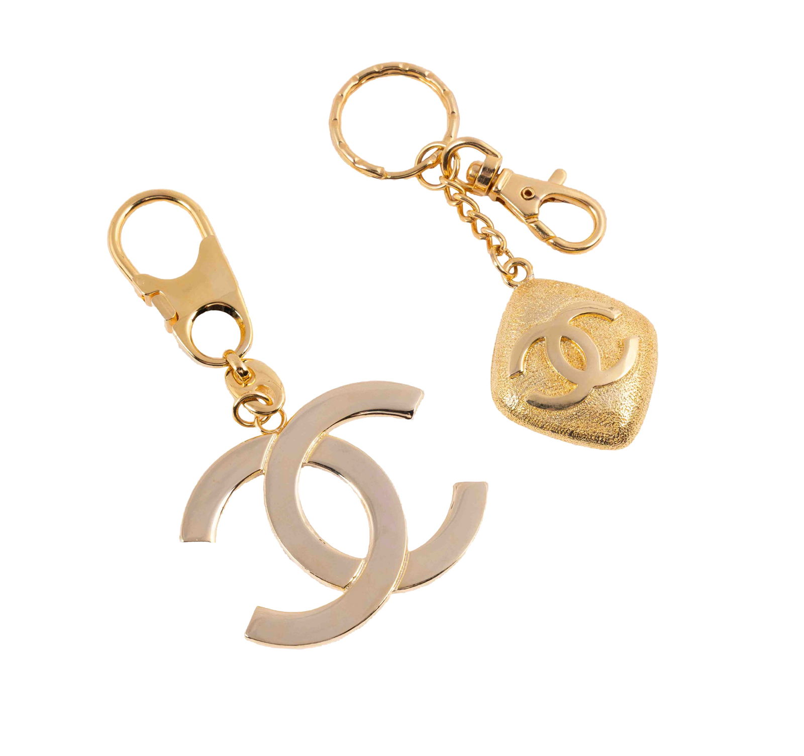 Pair of Chanel Keychains: A pair of goldtone Chanel keychains. Both in very good condition.