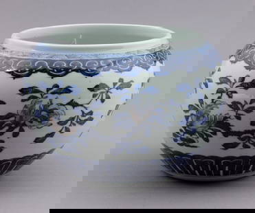 Chinese Blue, White and Copper 19th Century Vase: A Chinese underglaze blue, white and copper red bowl in compressed globular form, decorated with branches of peaches, finger citron and pomegranates within ruyi head and lappet borders. Possibly 19th