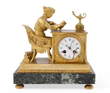 French Bronze and Marble Empire Clock featuring The Reading Woman: This is a beautiful bronze and marble Empire clock that features a young woman reading a book, seated in an antique-style chair. It is known as "The Reading Woman." It is composed of bronze,