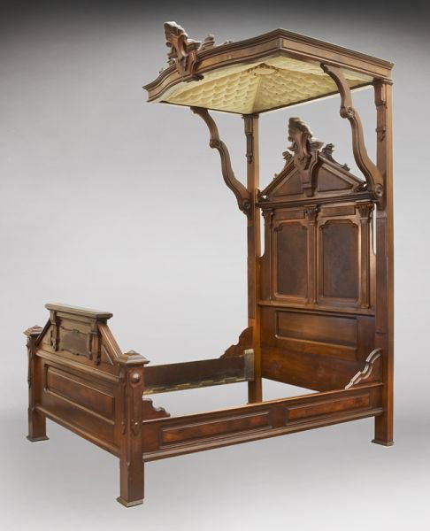 American Victorian carved walnut half tester bed: American Victorian carved walnut half tester bed with a shaped molded half tester with large carved central medallion, supported by shaped brackets, the headboard, footboard and rails with raised burl