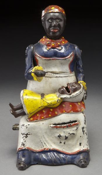 Cast iron Mammy and Child mechanical bank,: Cast iron Mammy and Child mechanical bank, manufactured by Kyser & Rex Co., Philadelphia, P.A., working condition. 7.5"H, Circa - 1885.