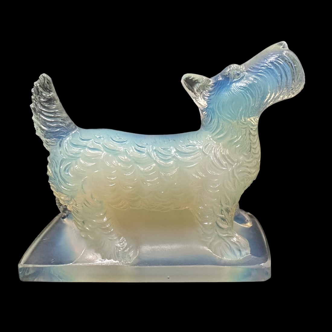 Sabino Glass Scottish Terrier in Opalescent: A cute Scottish Terrier Dog by Sabino. Measuring H 3 x W 4 x D 3 inches. Signed on the underside base, Sabino Paris in script. Excellent condition.