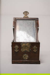 Antique Chinese Qing Traveling Apothecary Wooden Box: A stunning antique Chinese travelling apothecary box in carved rosewood. The outside is decorated with accenting brass fixtures, including shaped handles and hook closure. The box opens to a smoked