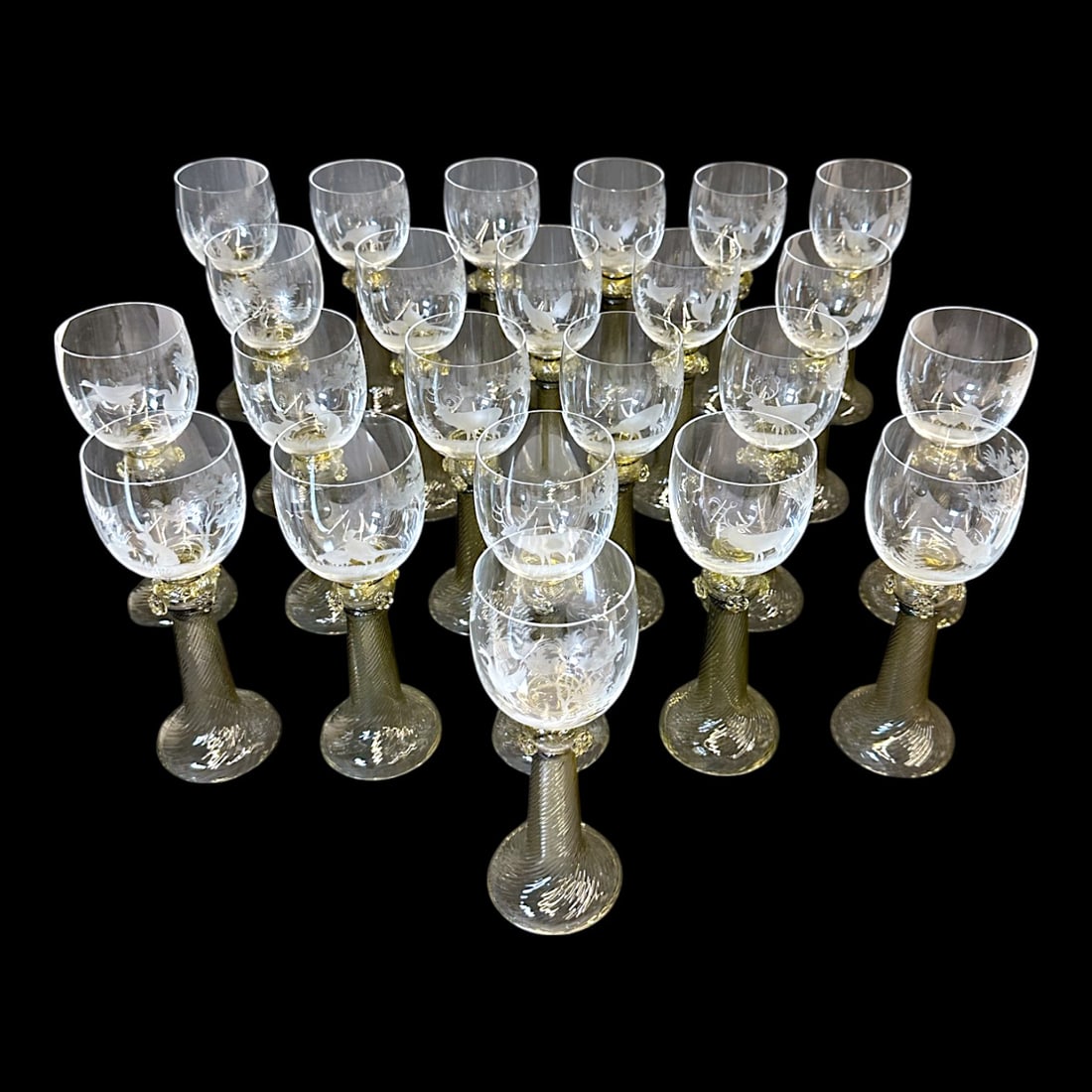 Gorsuch glass goblets with wildlife etchings - Set of 23: Set of 23 Gorsuch glass goblets featuring etchings of pheasants, elk, forest, etc. Set of 23. Measuring: H 8.5 x W 3 x D 3 inches Condition: No visible signs of damage or repair