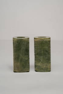 Pair of Chinese Carved Jade Liangzhu: A pair of Chinese carved jade Liangzhu, decorated with extremely intricate and subtle carving portraying butterflies. Both ends of the vase are open.&nbsp; Measuring: H 5 x W 2.5 x D 2.5 inches Condit