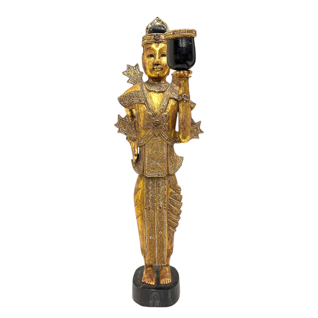 Gold Gilded Standing Carved Wood Buddha: Gold Gilded Standing Carved Wood Buddha likely from Thailand. There are silver mirrored stones all over the fabric of the figure, along with intricate designs. The figure is holding a cup in one hand,
