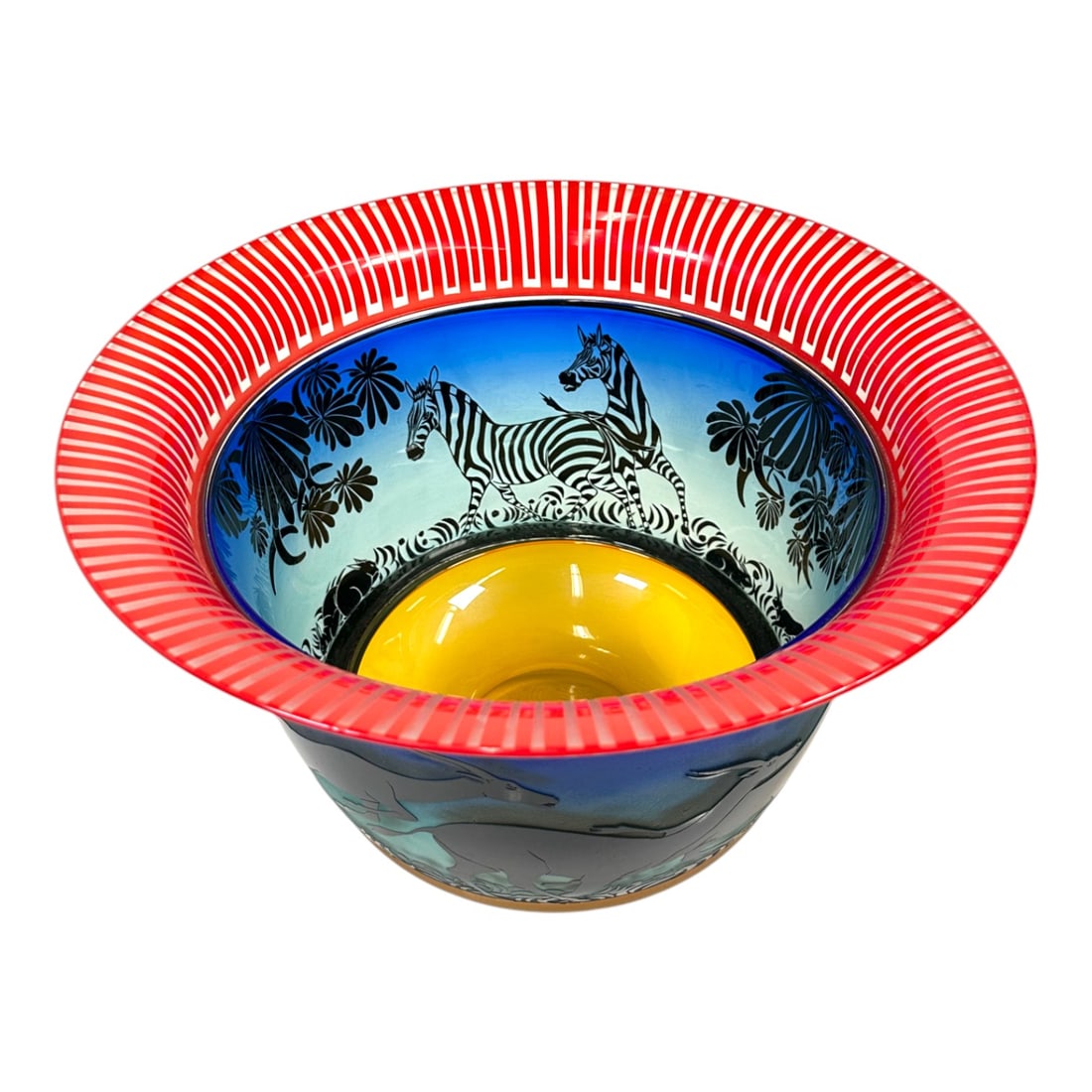 Modern Gary Genetti Handblown Glass Antelope Vessel: A beautiful original handblown glass vessel by Gary Genetti featuring etched antelopes, zebras, rabbits, and elaborate foliage. Measuring: H 11.25 x W 15.5 x D 15.5 inches Condition: very