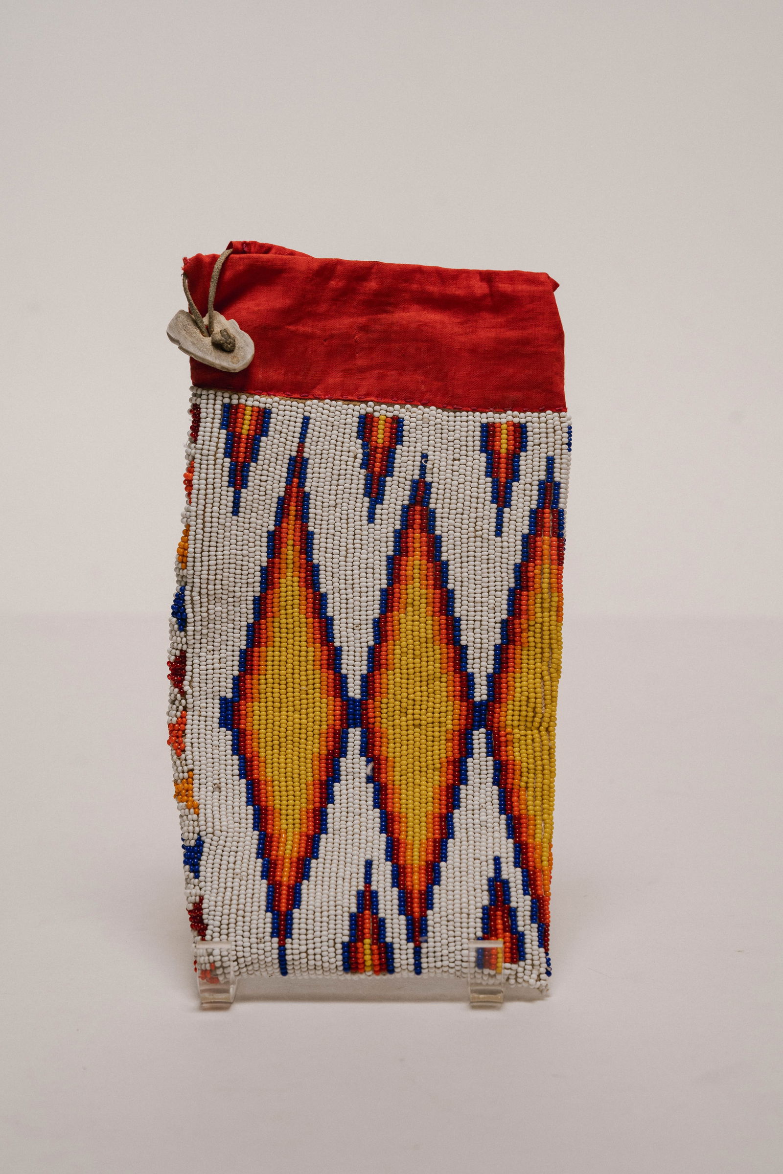 Vintage Native American Hand-Beaded Linen Pouch: A Native American, hand-beaded linen pouch. Dimensions: H 10 x W 5 x D 0.75 inches Condition: Signs of age, but otherwise good condition 