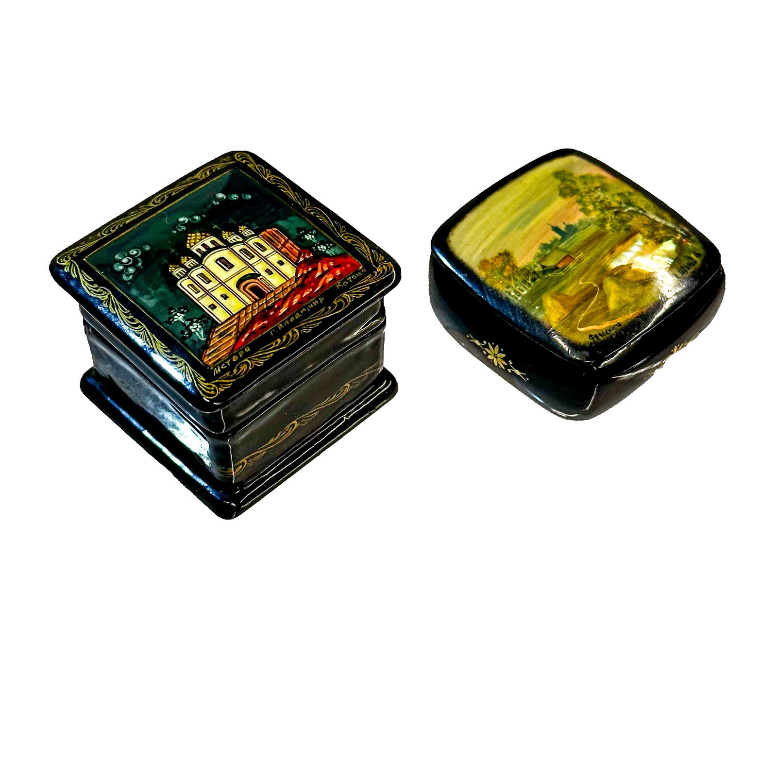 Vintage Pair of Russian Made Lacquer Pill Boxes: A beautiful pair of Russian made lacquer pill boxes crafted from paper-mache. The tallest box features a hand painted Russian cathedral on the lid with Russian words on the lower line and a gold star