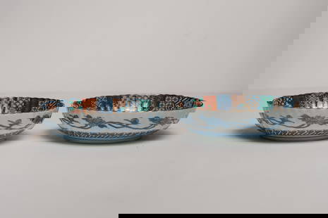 Pair of Arita Ware Ryuhou Kiln Porcelain Serving Bowls: A fine pair of Arita Ware Ryuhou Kiln porcelain serving bowls, finely decorated with intricate colorful geometrical and botanical elements. Both feature a gold rim and scrolling chrysanthemums on the