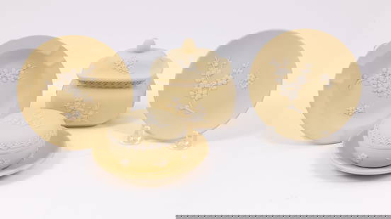 Collection of Five Wedgwood Jasperware Pieces in Yellow: This collection of five Wedgwood Jasperware pieces includes: - two small decorative plates with a diameter of 4 inches - one ashtray with a diameter of 4.5 Inches - one small round lidded vessel dimen