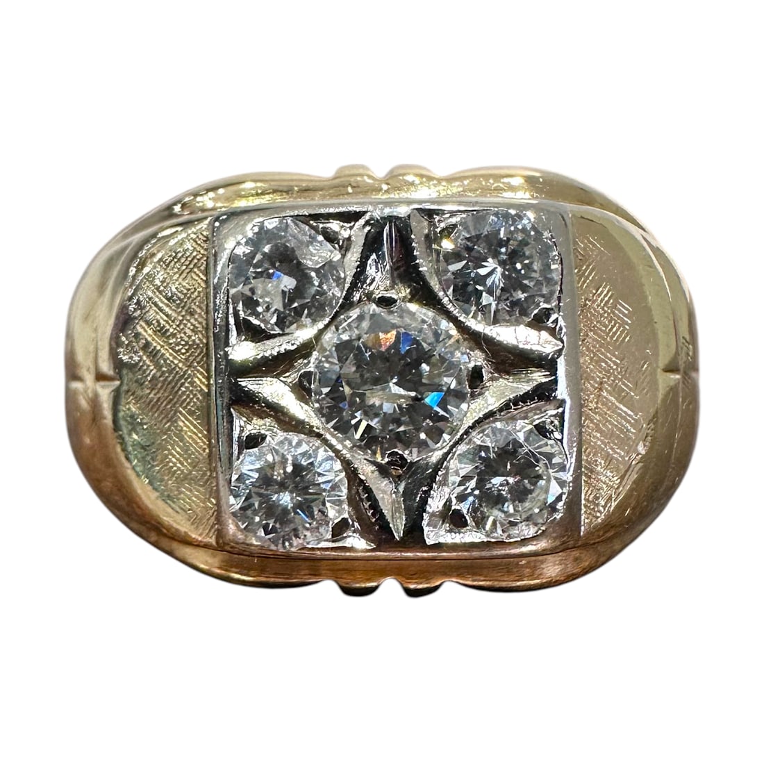 Gentlemans Vintage Gold & Diamond Ring: A stunning mans diamond ring. Center round diamond of .25 carats with 4 smaller surrounding diamonds set in 14 kt yellow gold. 9.07g H 1 W 2 D 1 inches.