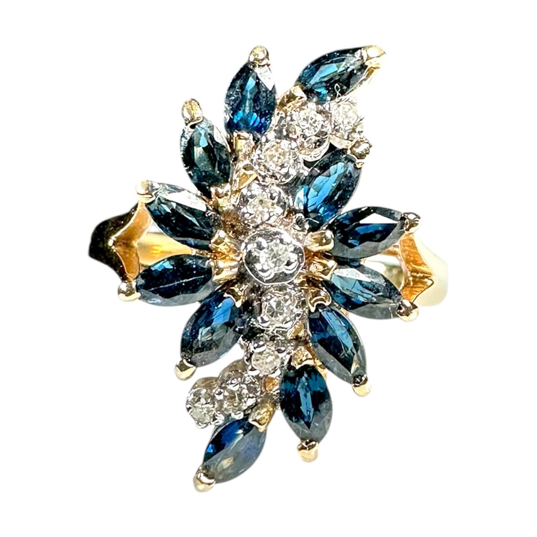 Ladies Vintage 14k Yellow Gold Ring with 9 .02 Carat Diamonds Surrounded by Marquise Blue Sapphires: Ladies Vintage 14k Yellow Gold Ring with Diamonds Surrounded by Marquise Blue Sapphires. Size: 6 TCW: 9 x .02, .18 TCW Total Weight: 3.8 Grams Shape: Round Surrounded by Marquise Blue Sapphires 
