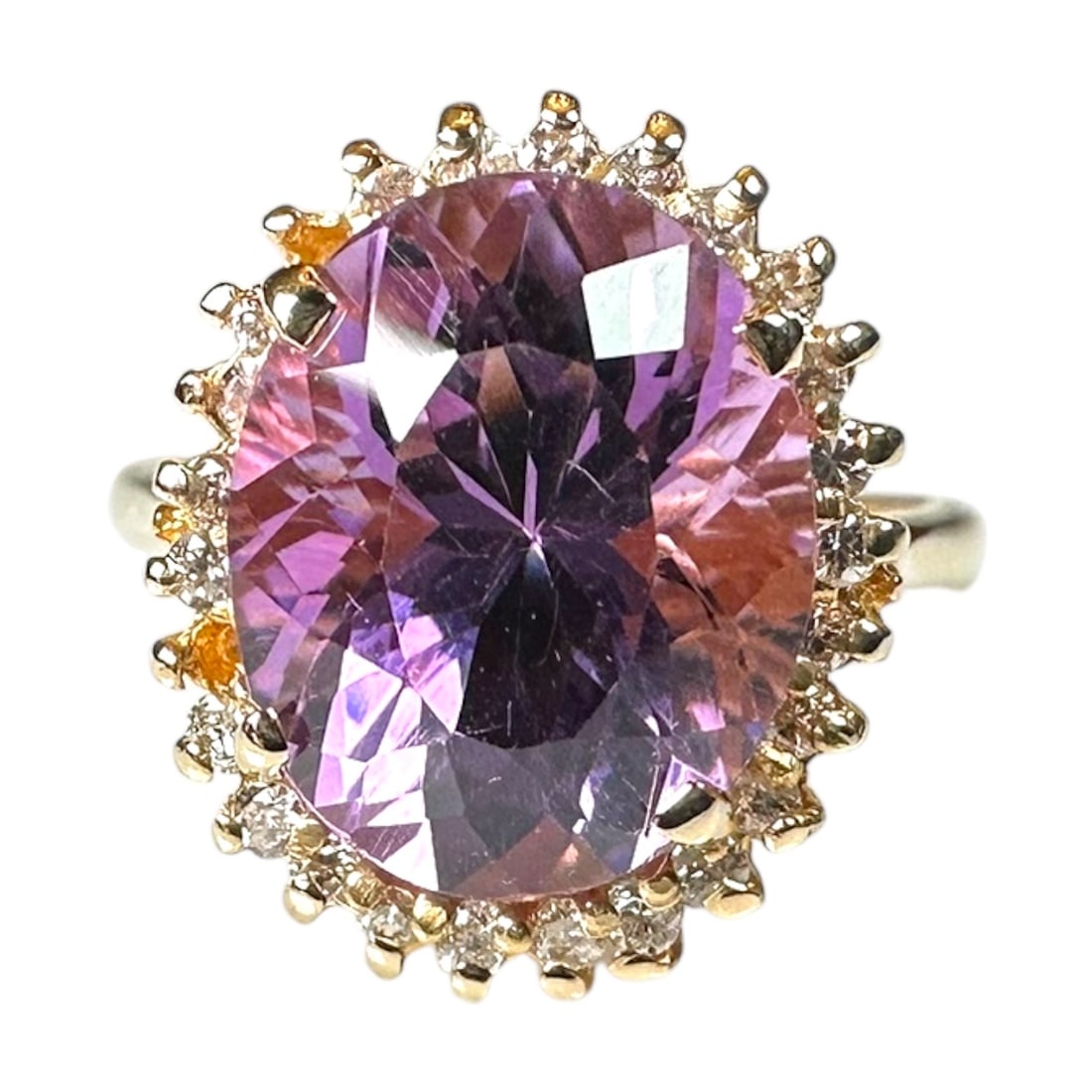 Ladies Vintage 14k Yellow Gold Ring with One Oval Amethyst and 24 Small .01 Carat Diamonds: Ladies Vintage 14k Yellow Gold Ring with One Oval Amethyst and 24 Small Diamonds Size: 6 TCW: 24 x .01, .24 TCW Total Weight: 5.7 Grams Shape: Oval Amethyst Su