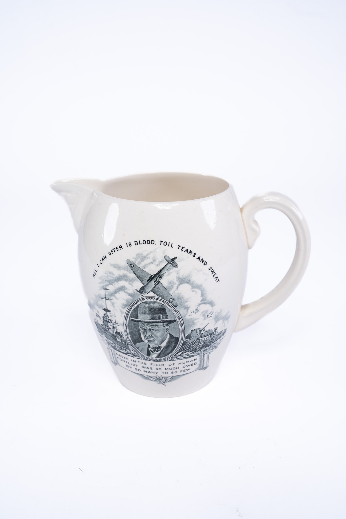 Wartime Pitcher Featuring an Image of and Quotes by Prime Minister Winston S. Churchill: Wartime Pitcher Featuring an Image of and Quotes by Prime Minister Winston S. Churchill. ngland: Copeland/Spode, 1941. This is a handsome piece of Churchilliana, an illustrated jug produced by Copelan