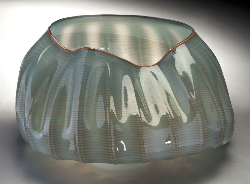 Dale Chihuly seaform glass basket, 1981,: Dale Chihuly seaform glass basket, 1981, of transparent seafoam green with orange rim and striations. Etched signature on the underside "Chihuly 1981". Dale Patrick Chihuly (American, b. 1941). Proven