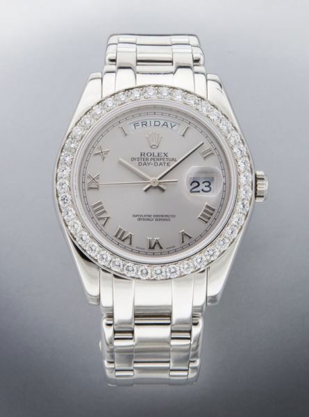 Rolex Masterpiece platinum and diamond wrist watch: Rolex Masterpiece platinum and diamond wrist watch Masterpiece Oyster Perpetual Day-Date model, having a 31 jewel movement, with a circular matte silver-tone dial, mounted with Roman numerals, with da