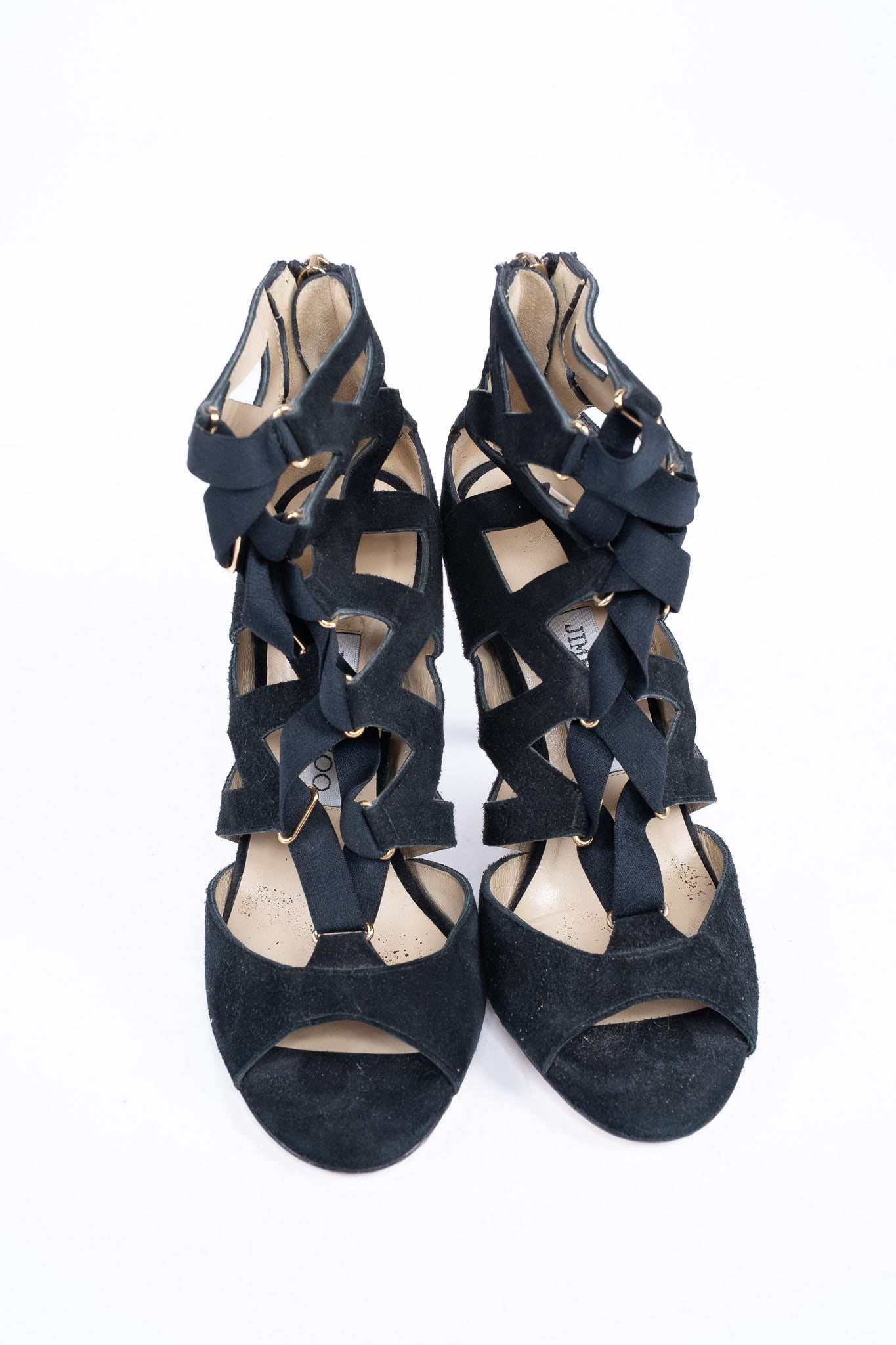 Jimmy Choo Black Suede Cage Open Toe Heels: Jimmy Choo Black Suede Cage Open Toe Heels. Black elastic straps up front of shoes. Tan soles. Made in Italy. Size: 37 Condition: Used, scuffs and sticker residue on bottoms of shoes, wear in in
