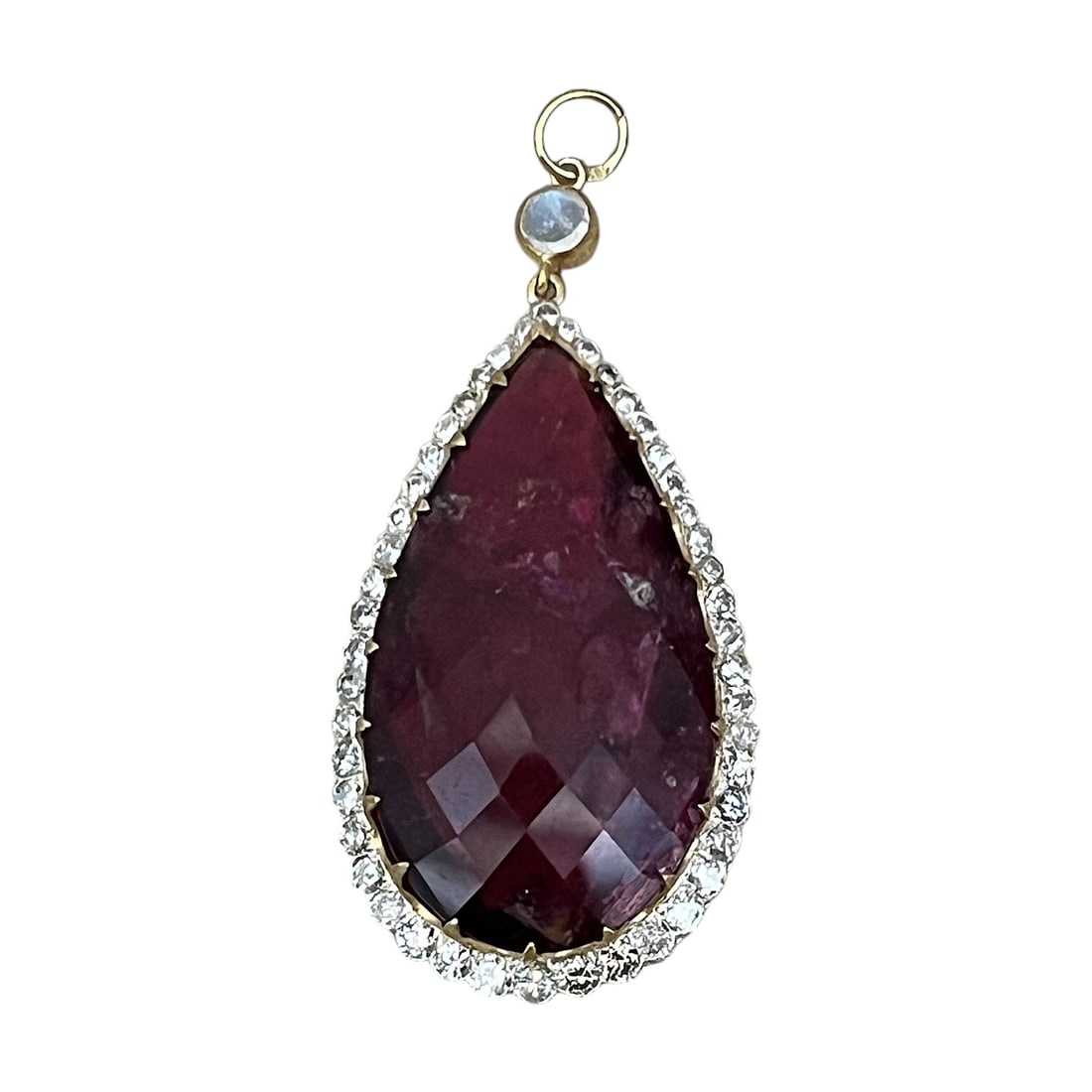 Ladies Moonstone, Diamond and Rubellite Pendant: What a gorgeous pendant. The teardrop shaped natural Rubellite is 12.55 carats. It is surrounded by 48 full cut diamonds with a total carat weight of 2 carats and a single moonstone that is .30