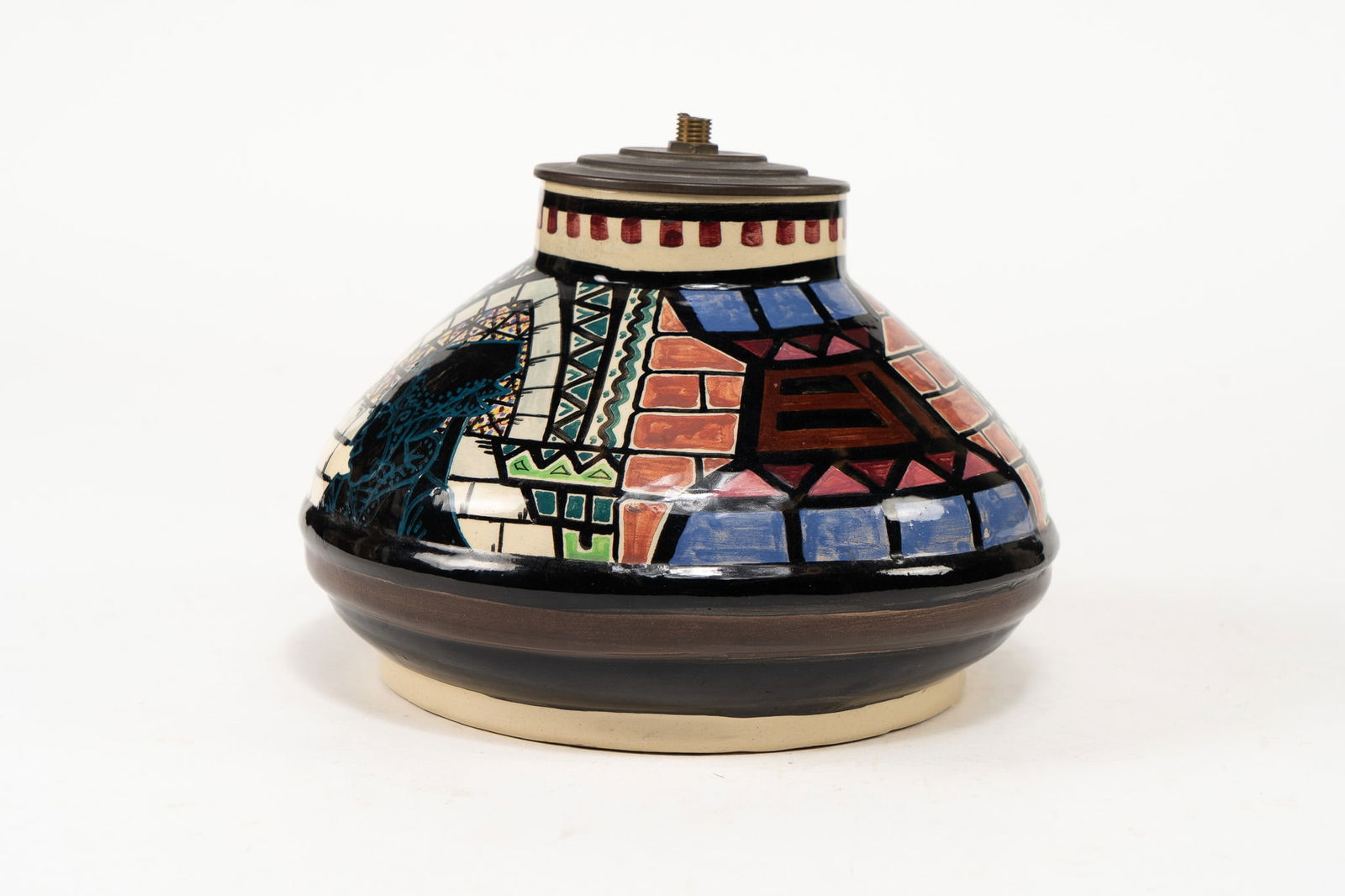 French Faience Fouillen Quimper Lamp Base: French Faience P Fouillen Quimper Lamp Base. Painted with Breton woman in blue and various geometric designs in blue, pink, red, brown, and green. Signed P. Fouillen Quimper on underside. Dimens